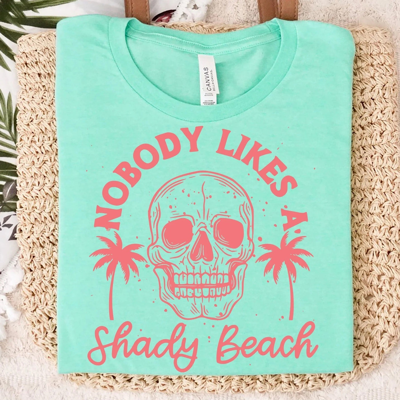 "Nobody Likes a Shady Beach" T-shirt (shown on "Mint")