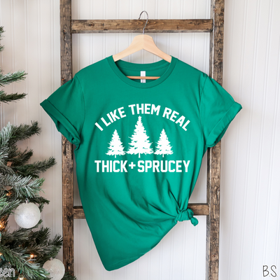 "I Like Them Real Thick + Sprucey" T-shirt (shown on "Kelly Green")
