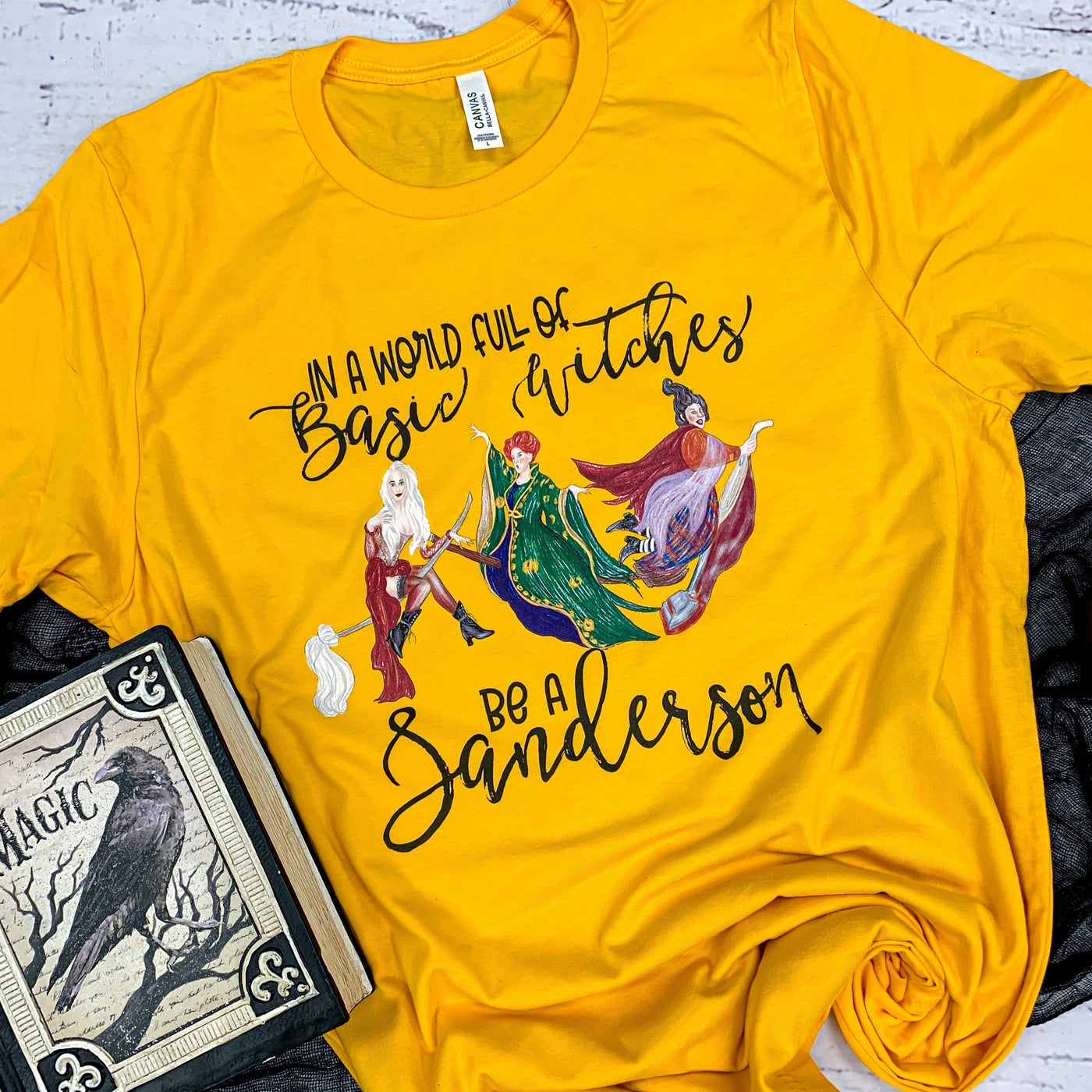 🌟 SALE 🌟 "In a World of Basic Witches, Be a Sanderson" T-shirt (shown on "Gold")