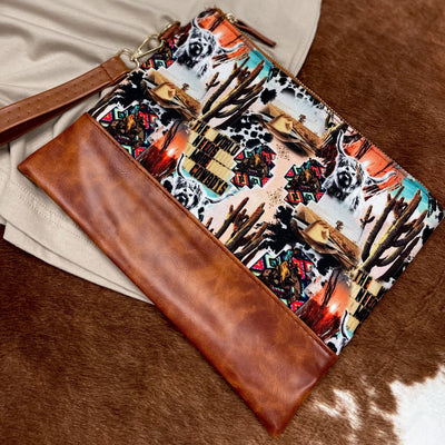 Wristlet handbag featuring the popular "cowboy collage" of western dreamin' - the perfect gift idea for the vagabond or traveler in your life!