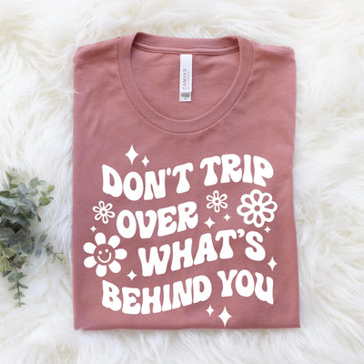 "Don't Trip Over What's Behind You" T-shirt (shown on "Mauve")