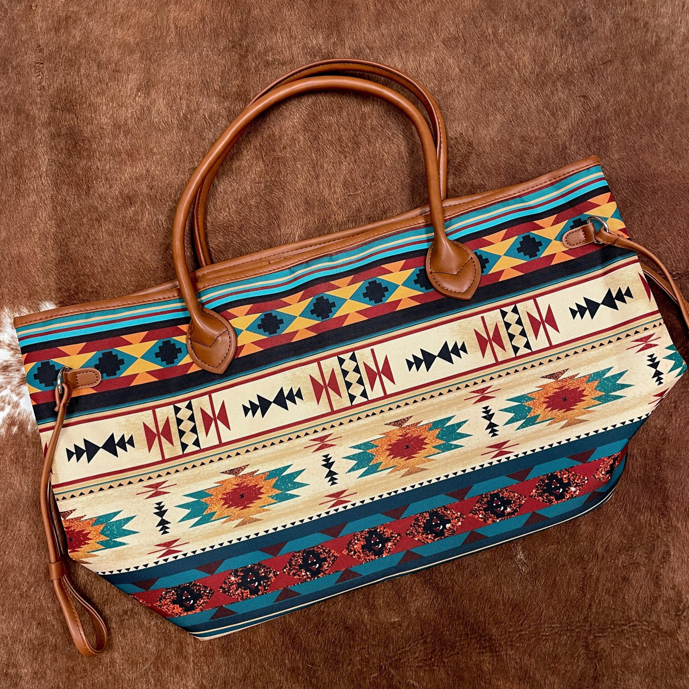 Weekender tote bag featuring a boho aztec pattern - the perfect western-inspired gift for the traveler in your life!